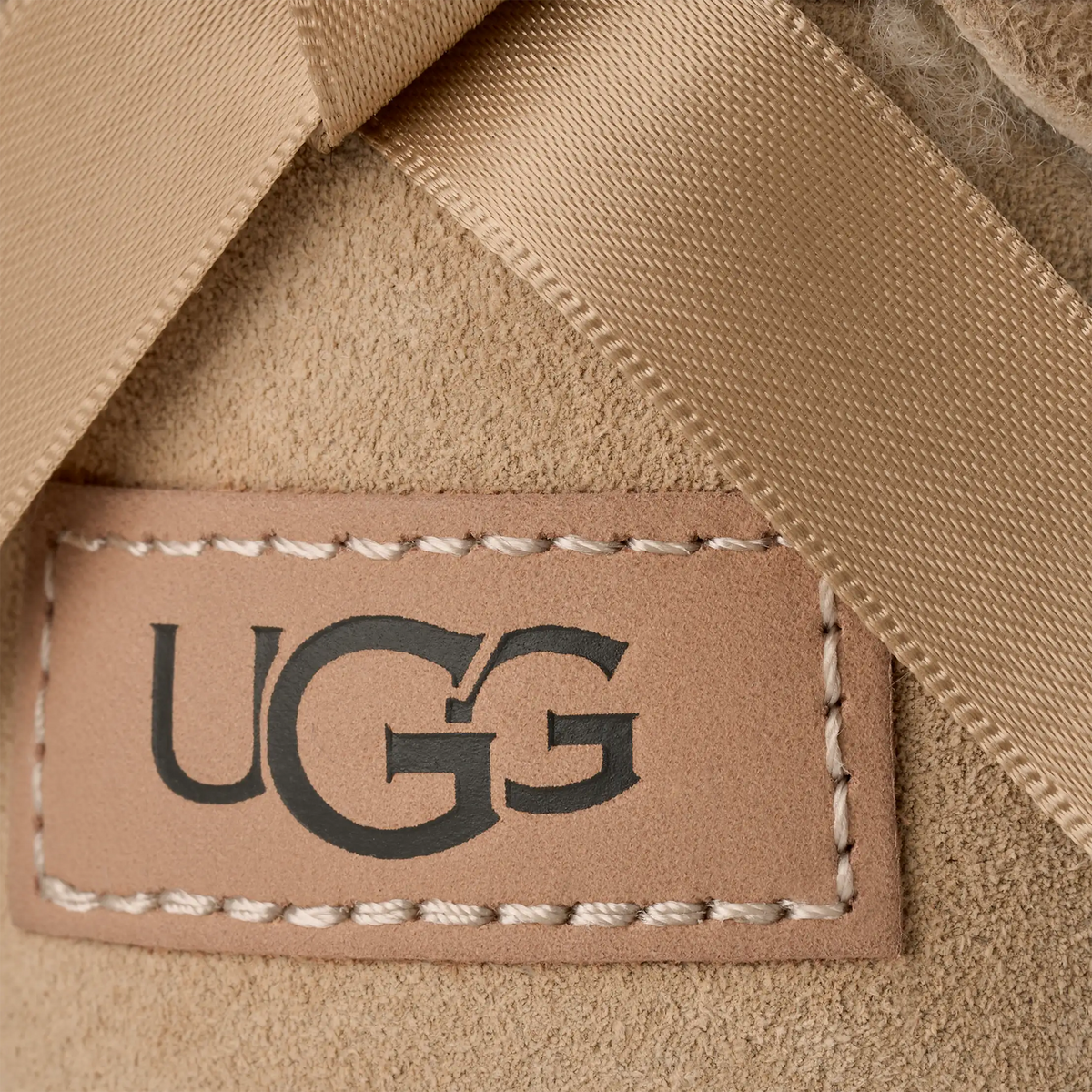 UGG® Classic Ultra Mini Bailey Bow (Women) - Sand