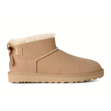 UGG® Classic Ultra Mini Bailey Bow (Women) - Sand