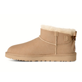 UGG® Classic Ultra Mini Bailey Bow (Women) - Sand